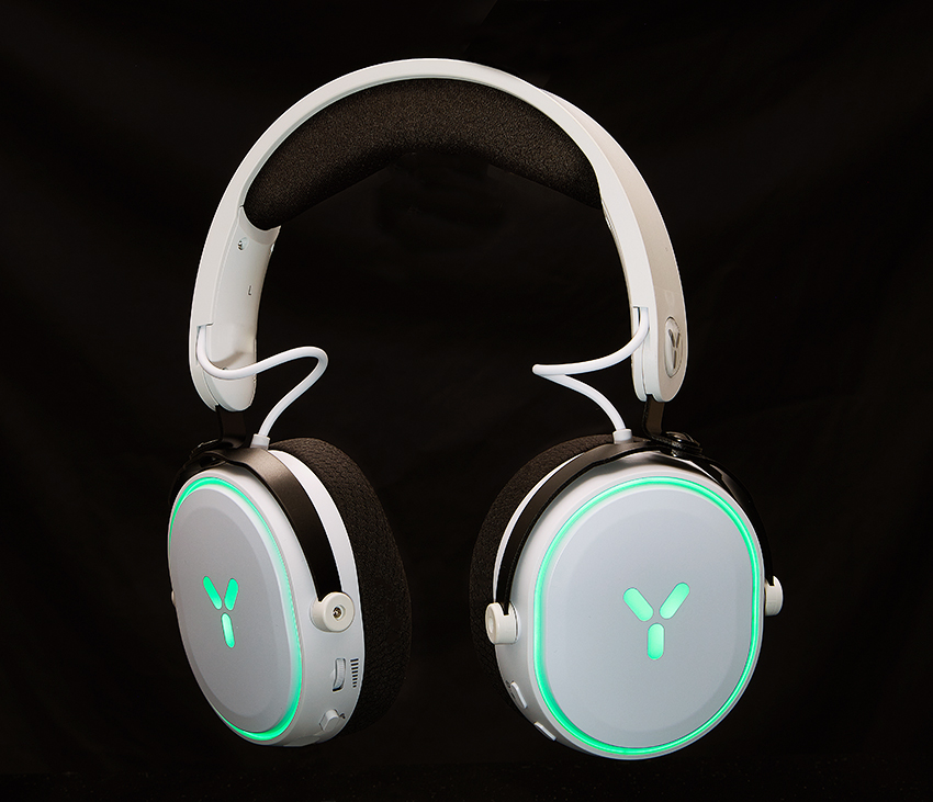 White gaming headphones with glowing green accents floating against a black background
