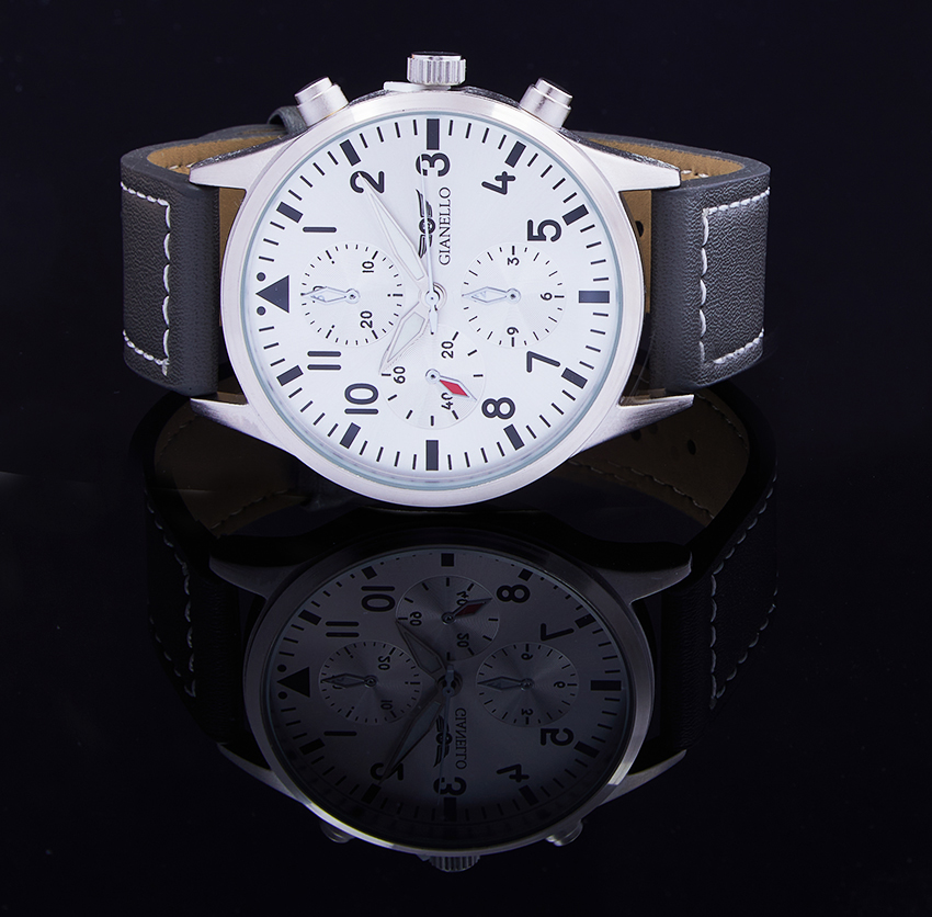Gianello watch with white dial and black reflection on a polished black surface