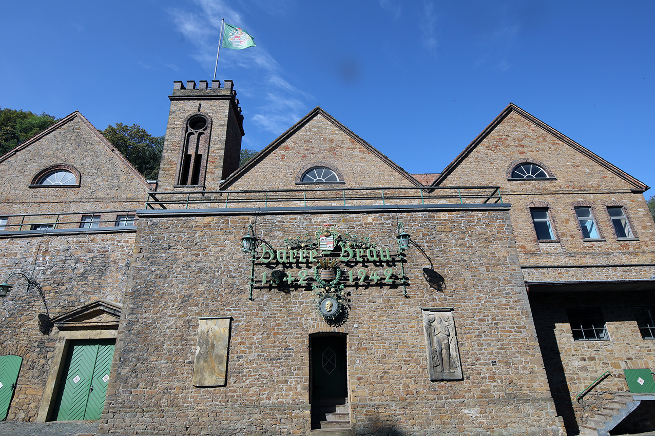 The historic stone brewery buildings of Privatbrauerei Ernst Barre with the Barre-Bräu sign