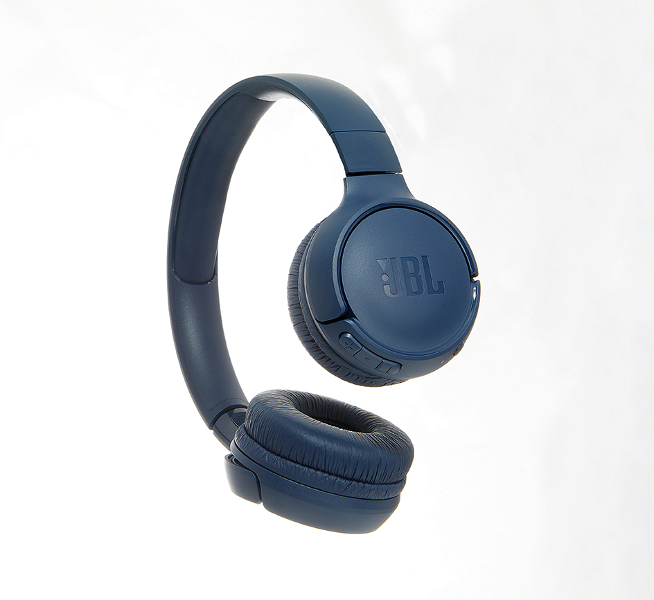 Floating navy JBL wireless headphones against a clean white background